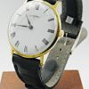Montre PIROFA plaquée or, boîtier et bracelet noir de trois quarts