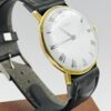 Montre PIROFA, profil du boîtier plaqué or et bracelet noir